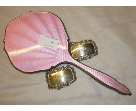 Pink enamel dressing table mirror and two silver hall marked decanter labels for whisky and sherry 