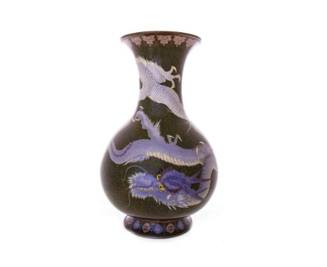 EARLY 20TH CENTURY CHINESE CLOISONNE ENAMEL VASEwith trumpet neck and globular body, on flared circular foot, the two dragons