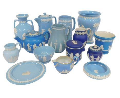 A group of Dudson Brothers blue sprig moulded jugs and vases, including a tapered ovoid vase, 20cm high, twin-handled vase, 1