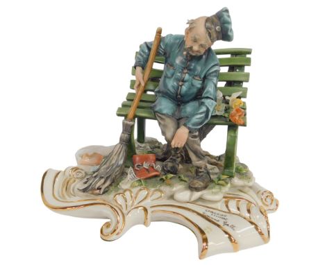 A Capodimonte porcelain figure modelled as Spazzino Scultore by Tiziano Galli, painted marks, 23cm high. 