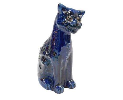 An Aller Vale style pottery cat, blue glaze, in seated position, 16cm high.
