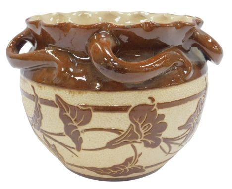 A late 19thC Brannam Barum pottery four-handled brown glazed jardiniere, with a frilled rim, decorated centrally with a band 