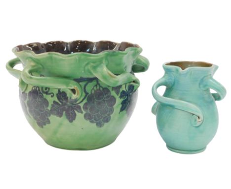 An early 20thC Barum Barnstaple green glazed pottery jardiniere, with six handles and a frilled rim, painted with a band of v