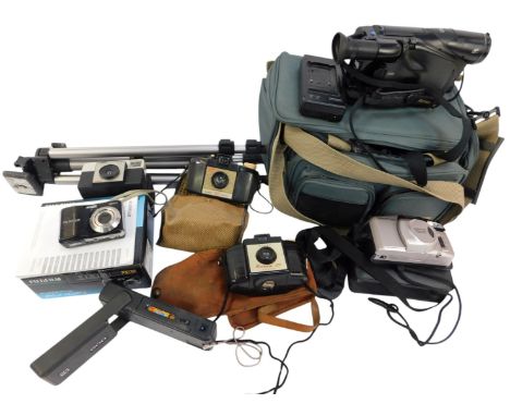 A group of cameras and optical equipment, to include a Panasonic camcorder, MV-R33B, in a canvas carrying case, camera tripod