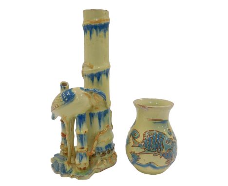 A late 19thC Brannam Barum pottery spill holder, of bamboo form, with a figure of a heron, incised mark, 24cm high, together 