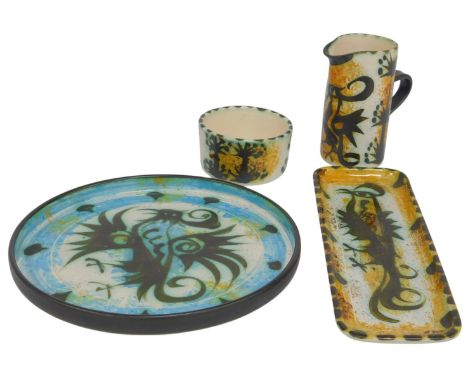 A group of Celtic pottery (Newlyn), including a jug, 13cm high, a bowl, an oblong tray, 29cm long, and a circular tray, 24cm 