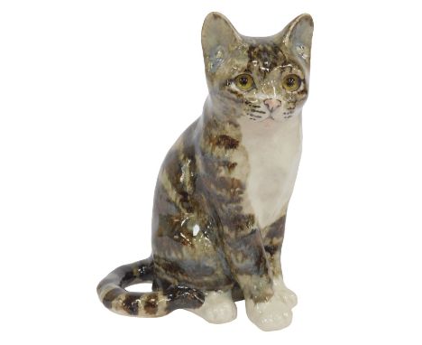 A Winstanley pottery tabby cat, modelled in seated pose, signed, 22cm high. 