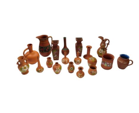 A group of Torquay terracotta pottery, including vases, a ewer, a jug, chamber stick, etc. (1 tray)