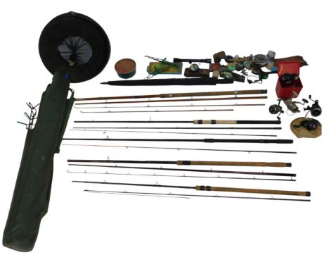 A collection of fishing tackle, including fixed spool and closed faced reels, sundry tackle, keep net, various rods, rod hold