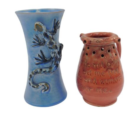 An early 20thC Brannam Barnstaple pottery vase, of waisted form, moulded with a lizard against a blue ground, incised mark, 1