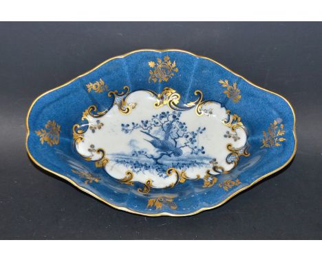 A Royal Worcester lobed oval dish, by R. Austin, printed in varying tones of blue, with a hummingbird on a blossoming branch 