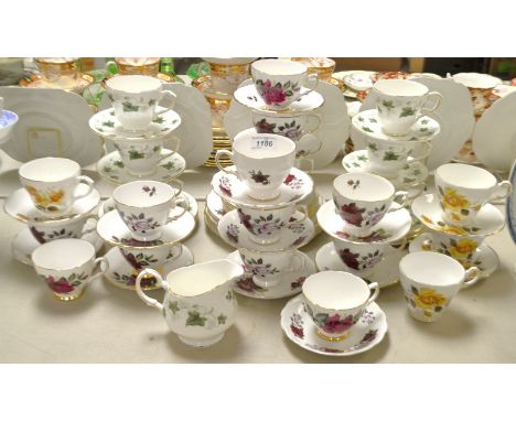 A Duchess Ivy pattern tea service for six; a Colclough rose pattern tea set ; another (3)