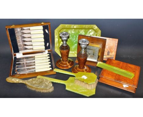 A pair of treen candlesticks; a treen cigarette box, hinged cover; a treen mounted desk barometer; an Art Deco dressing table