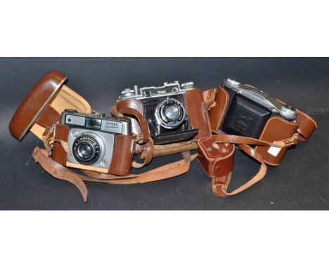 A Houghton Ensign Commando I folding camera, Ensar f3.5 75mm lens in Epsilon1-200 B shutter, leather case; an Ilford Sportsma