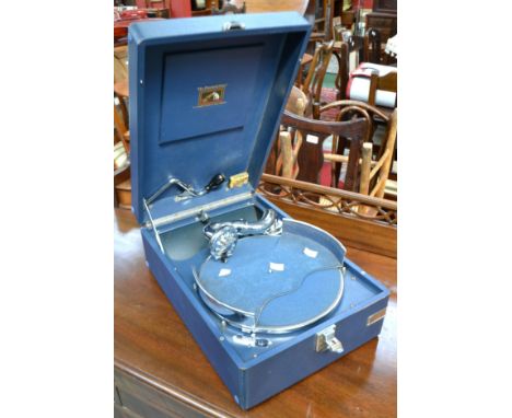 A vintage portable HMV gramophone, blue outer case, manual wind movement
