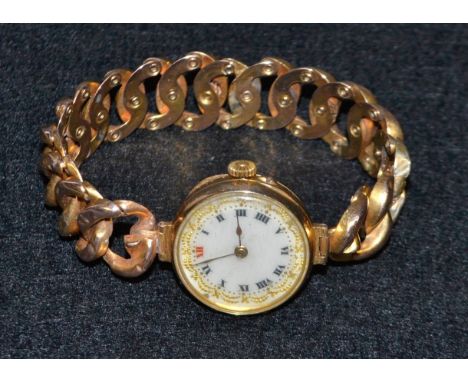 A lady's 9ct gold cased wrist watch, ceramic dial, Roman numerals, manual movement, hollow link concertina bracelet (af), 22g