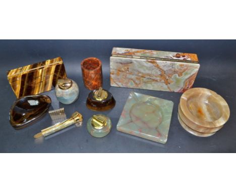 A large onyx cigar box; others similar; tigers eye, table lighter and ashtray set; a thuja wood caddy tidy.