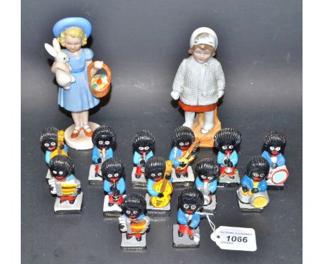 A Goebel figure, blonde girl in blue, with rabbit (faults); a Robertson Golly band (13); etc.