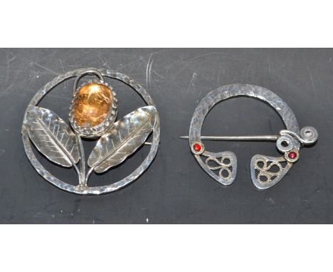 A large Arts and Crafts silver stone set brooch; a Celtic silver plaid brooch (2)