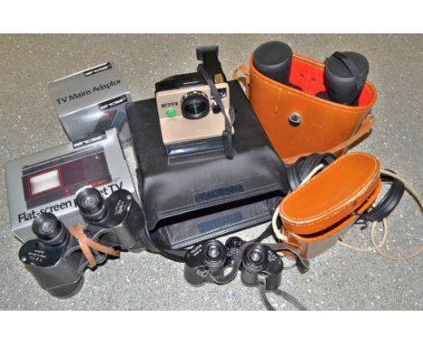 A pair of Telstar field binoculars, 80 x 30, 7.5 degrees No 87574; a pair pf 10 x 50 field glasses, 5.17; another pair, Cryst