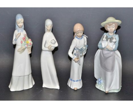 A Nao figure of a girl holding a pair of puppies; other Spanish figures of young girls (4)