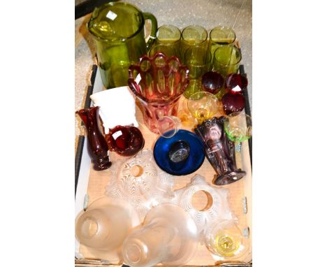 A ruby glass vase; a seven piece green glass lemonade set; other coloured glass; light shades.