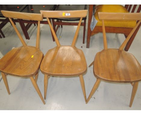 A set of three Ercol dining chairs with beech frames and elm seatsALL 3 SHOWS SIGNS OF WEAR, NO WOOD WORM