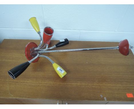 A vintage 1960's style atomic light fitting in red yellow and black 