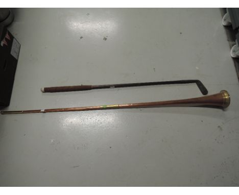 A vintage wooden shafted golf club and a copper and brass post horn