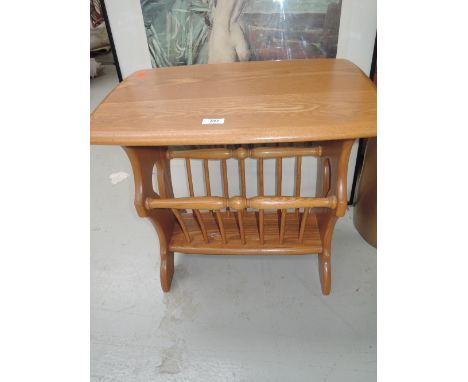 A vintage Ercol side table and magazine rack