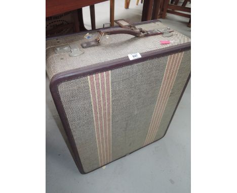 A vintage travel trunk suitcase with 50's design