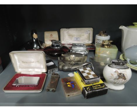 A selection of vintage cigarette and similar tobacco lighters