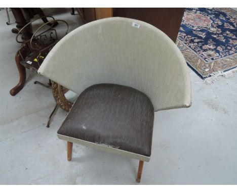 A vintage nursing chair having material back