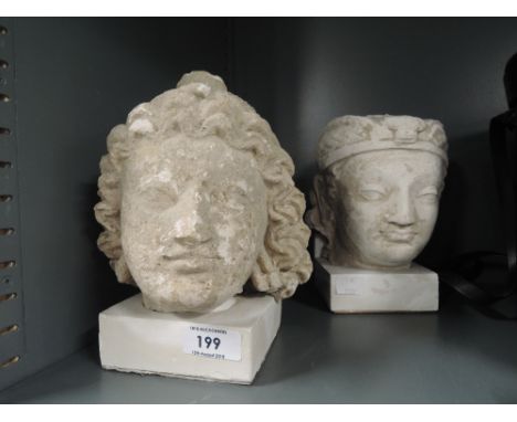 Two vintage plaster cast heads in an Indian style