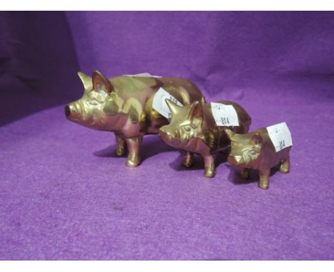 A selection of vintage graduated pig figures