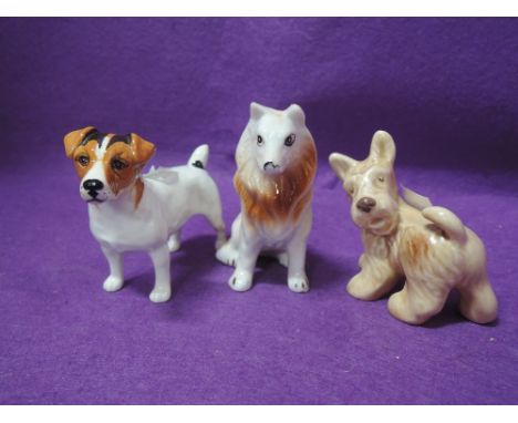 A selection of vintage dog figures and figurines including Beswick and Sylvac