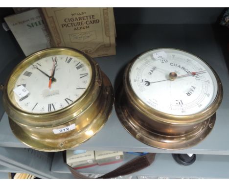 A vintage ships style barometer and clock