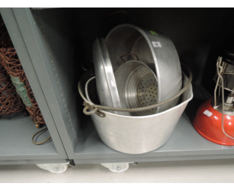 A selection of vintage kitchen items including aluminium jam pan