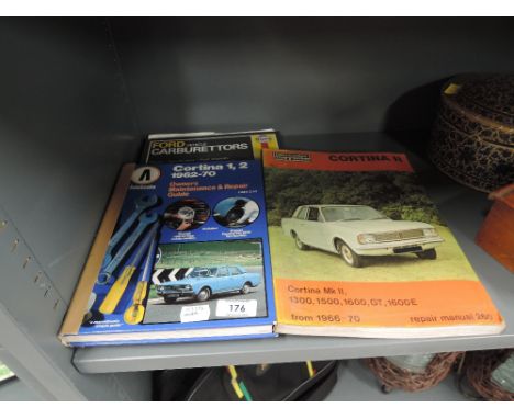 A selection of vintage Ford Cortina guides etc