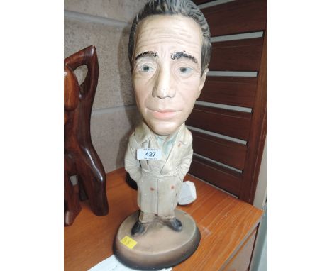 A vintage plaster cast character figure on Humphrey Bogart