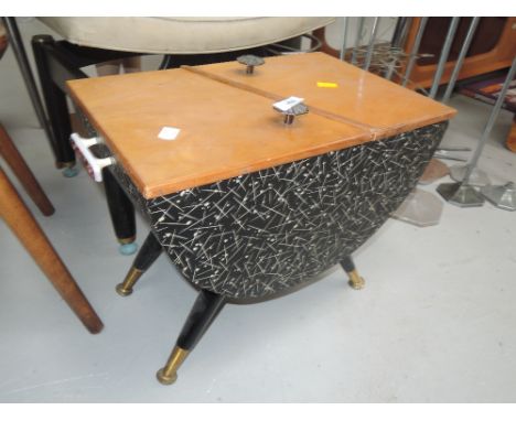 A vintage sewing box with Atomic design 60's print