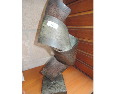 A vintage abstract metal sculptureApprox 42cm tall and 15cm wide 