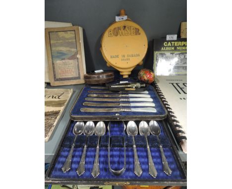 A selection of vintage items and cutlery