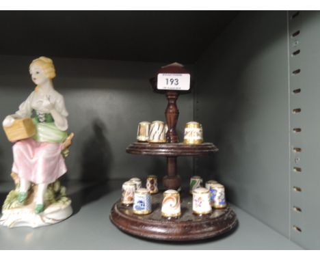 A selection of vintage thimbles and stand