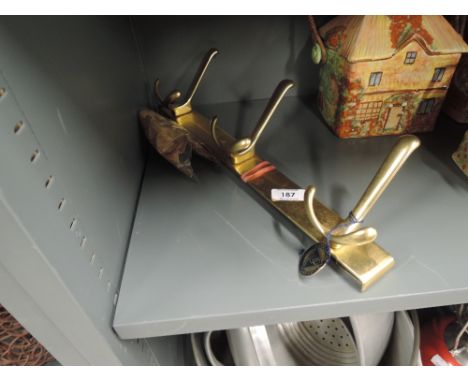 A vintage brass style coat hook rack