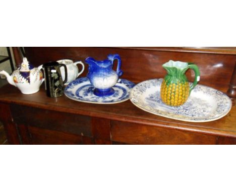 Two blue & white meat platters, a majolica "pineapple" jug, two jugs, a lustre teapot & another