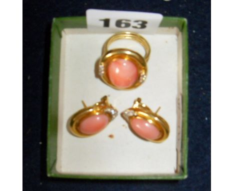 A 14ct gold (.585) ladies dress ring & earring set.  The ring having peach jade stone flanked by small diamonds, the earrings