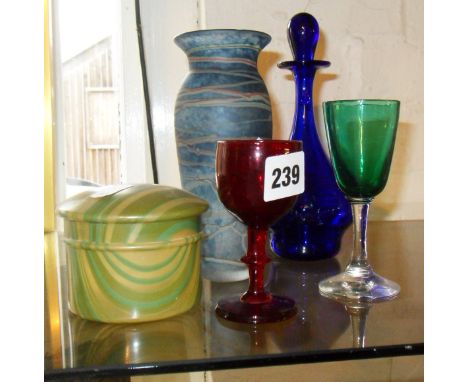 19th c. ruby glass stemmed port wine glass, another in green, a blue glass scent bottle, an Art Deco striated celluloid powde