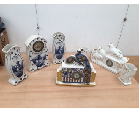 Three ceramic clocks to inc garnitures