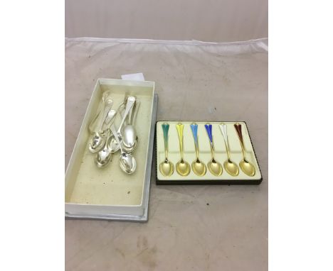 A set of six silver gilt and enamel spoons; together with eight spoons and tongs